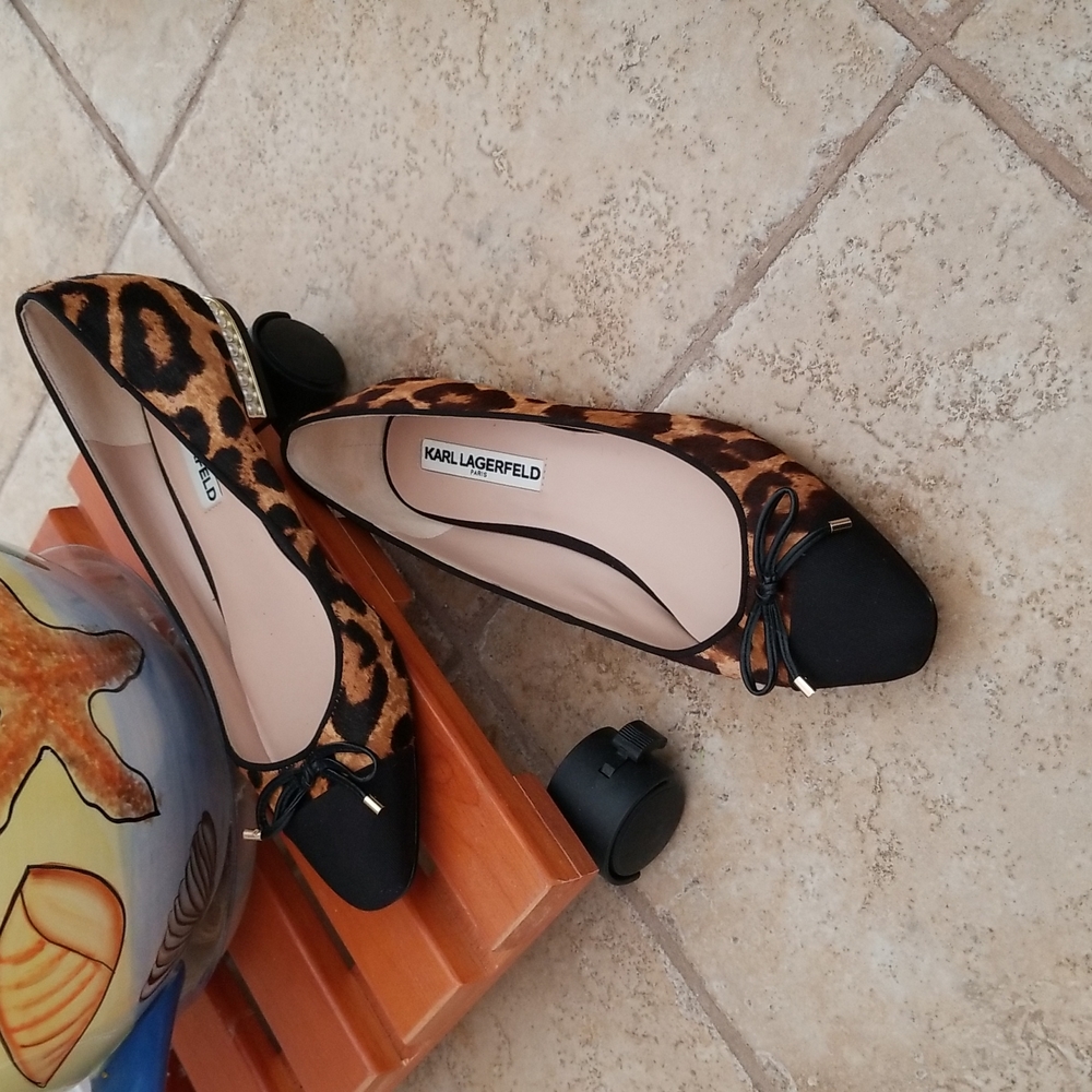 Karl Lagerfeld animal print flats trimmed with pearls.